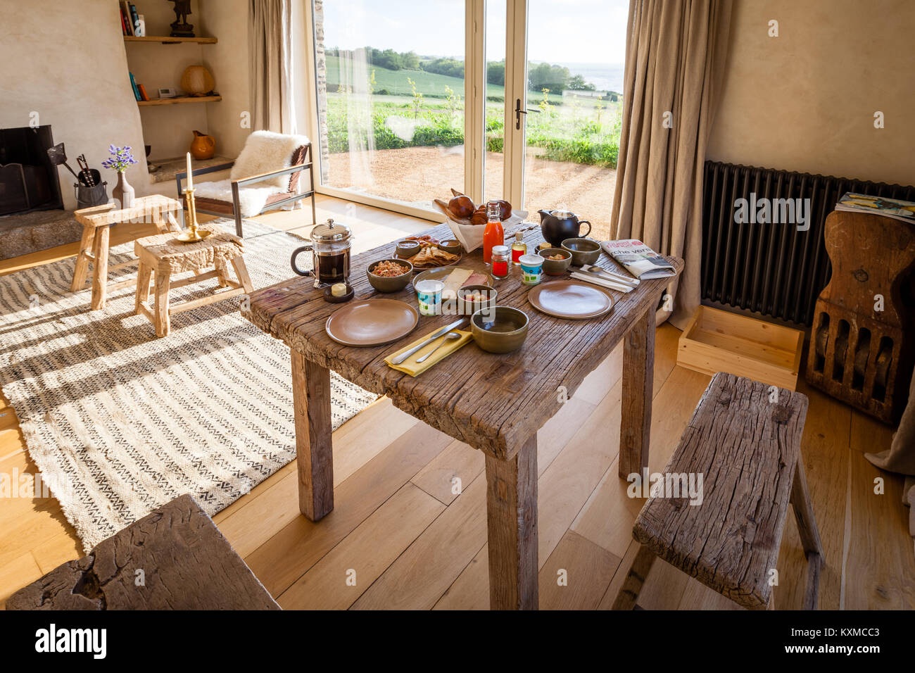The breakfast table is set, the coffee is cooked. We are at la Ferme du Vent, Brittany apartment Stock Photo
