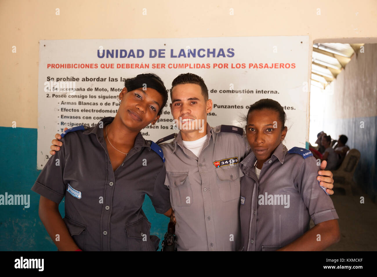 A Cuban police officer and two security guards in Havana, Cuba. Stock Photo