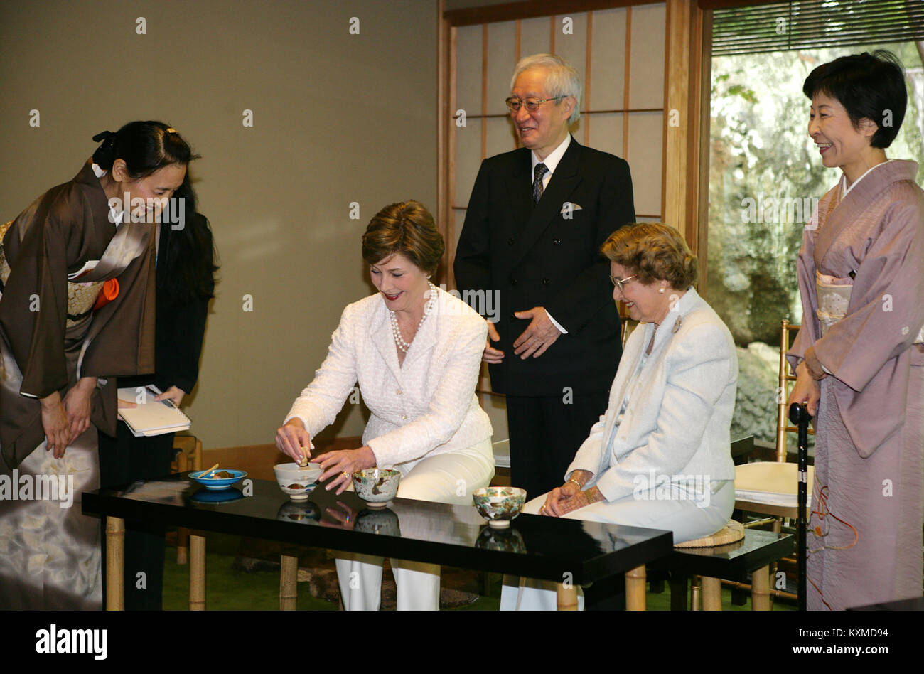 First lady Laura Bush, joined by her mother, Mrs. Jenna Welch, right, is given whisking instructions by Ms. Sakiko Akiyama, executive assistant to Grand Master Sen Genshitsu, left, while participating in a Japanese Tea Ceremony, Monday, April 17, 2006, in Washington, DC, with H.E. Ryozo Kato, Ambassador of Japan to the US, and his wife, Mrs. Hanayo Kato.  Mandatory Credit: Shealah Craighead / White House via CNP /MediaPunch Stock Photo