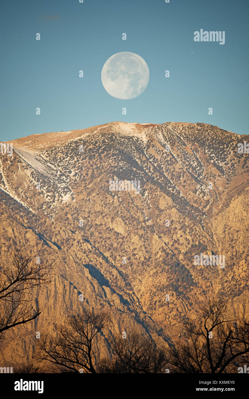 moon setting over the Wheeler Crest near Bishop California Stock Photo