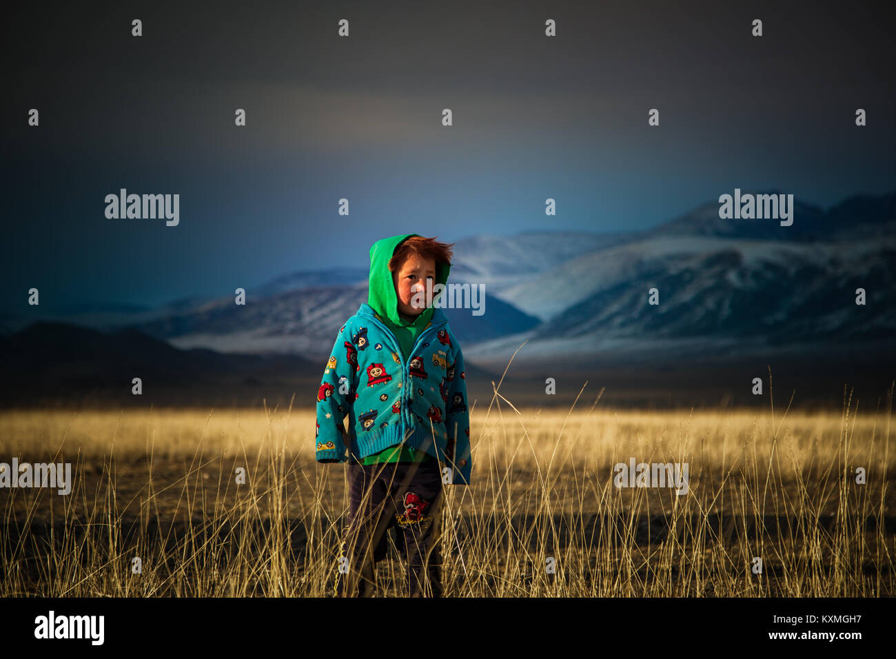 Country side rural kid ginger hair Mongolia steppes grasslands winter Stock Photo