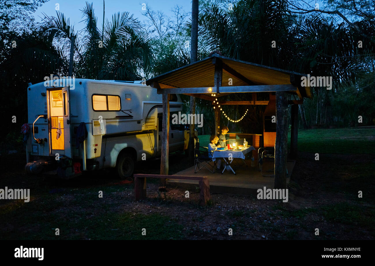 Campervan parked on campsite by picnic shelter at night,Bonito,Mato Grosso do Sul,Brazil,South America Stock Photo
