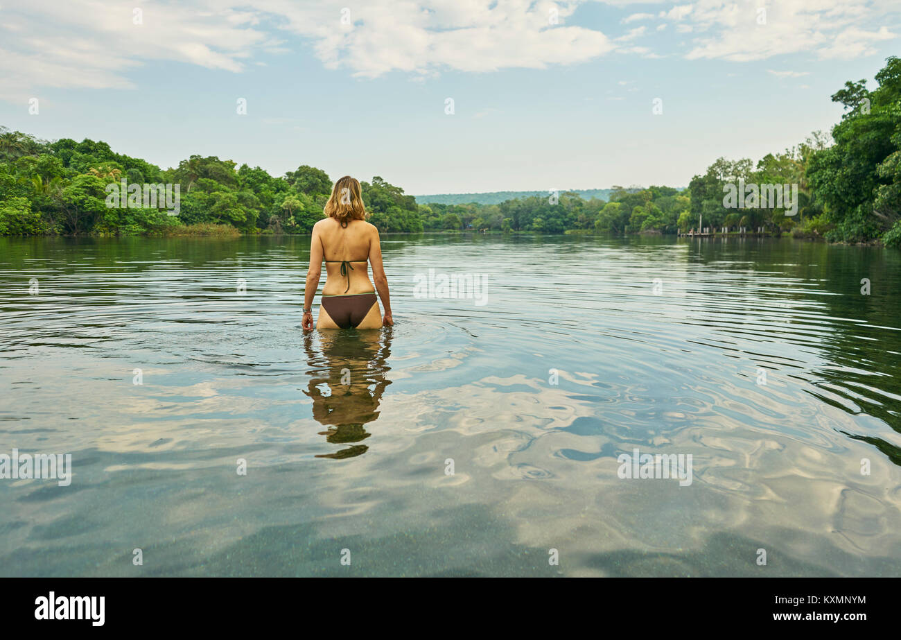Rear view of woman waist deep in lake,Aguas Calientes,Chuquisaca,Bolivia,South America Stock Photo