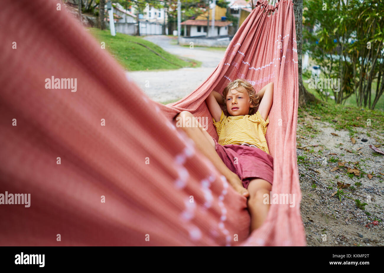 Boy lying in hammock,Tavares,Rio Grande do Sul,Brazil,South America Stock Photo