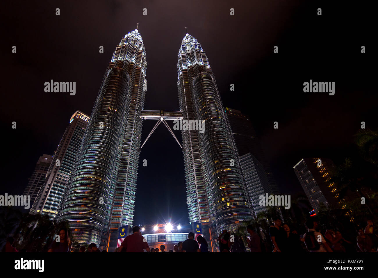 Petronas twin towers, Kuala Lumpur, Malaysia 10-09-2016.  Low angle of the Petronas twin towers, Kuala Lumpur, Malaysia with people in the foreground. Stock Photo