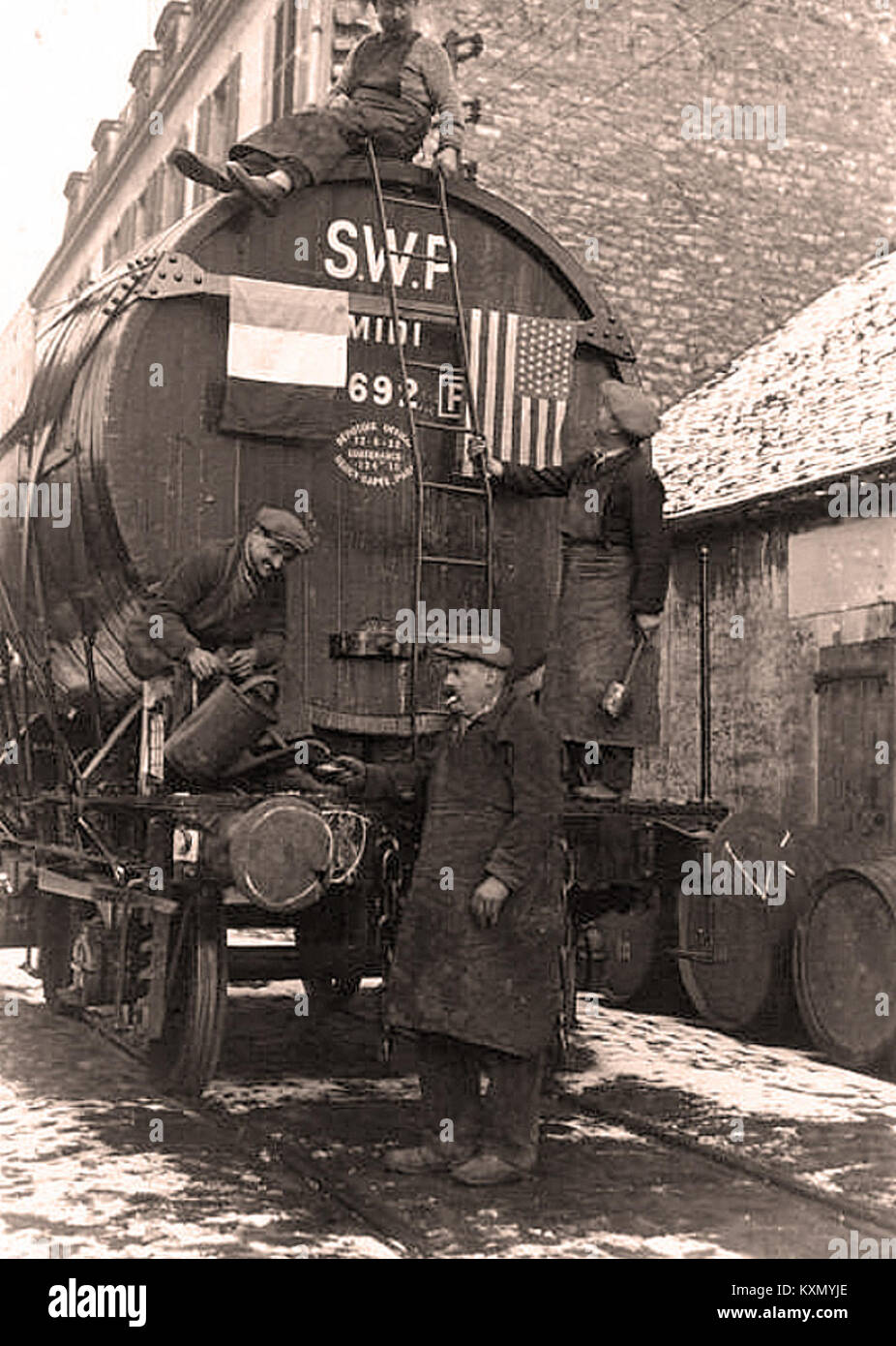 A historical photograph of a celebration in Bercy, featuring a wagon-foudre (a type of large barrel cart) during the festivities marking the abolition of prohibition in the United States in 1933. Stock Photo