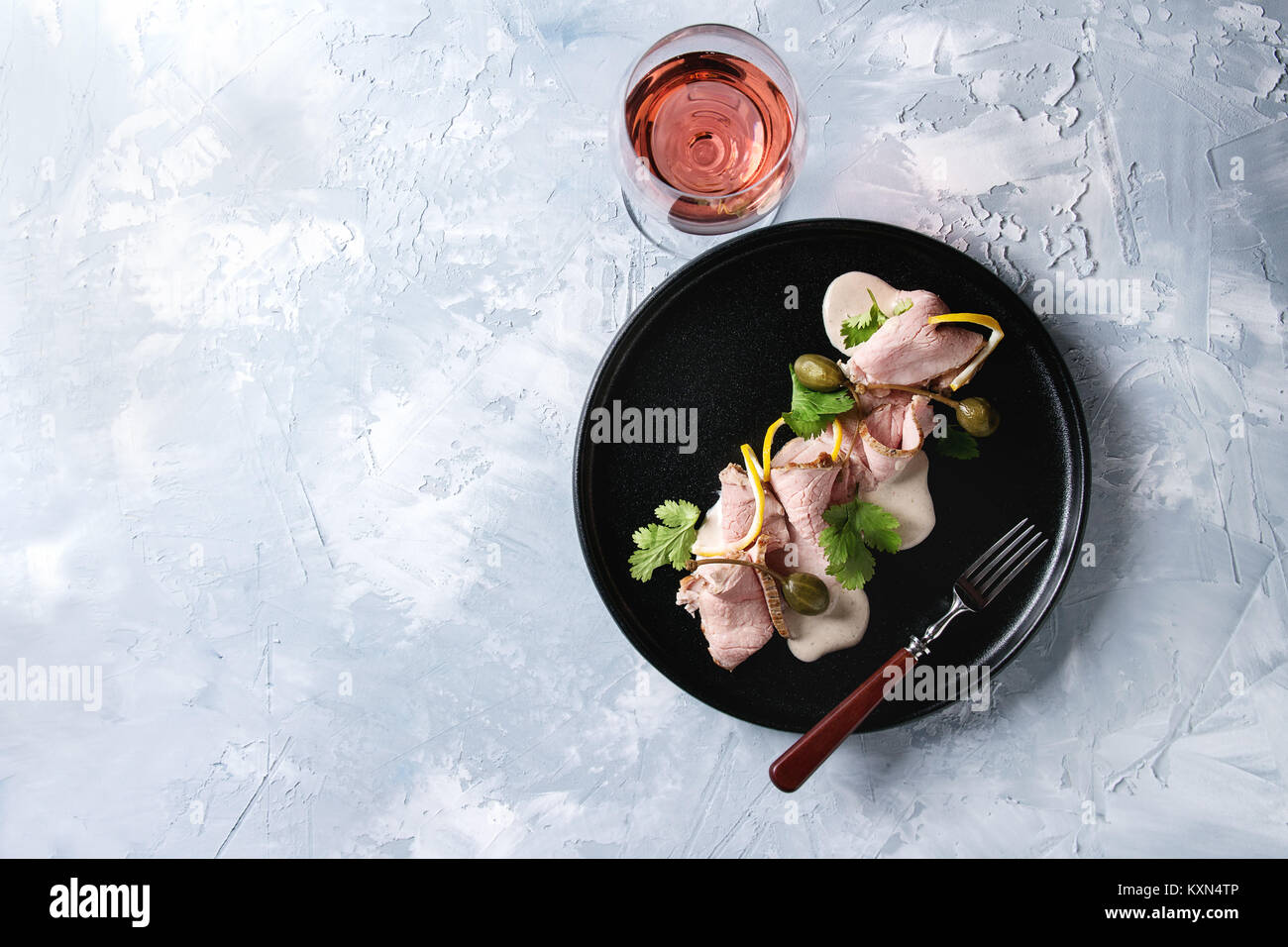 Vitello tonnato italian dish. Thin sliced veal with tuna sauce, capers