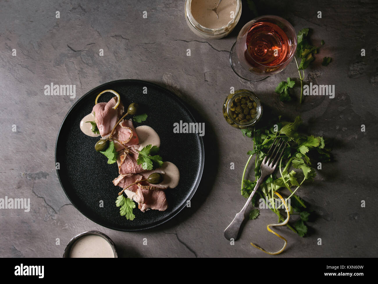 Vitello tonnato italian dish. Thin sliced veal with tuna sauce, capers