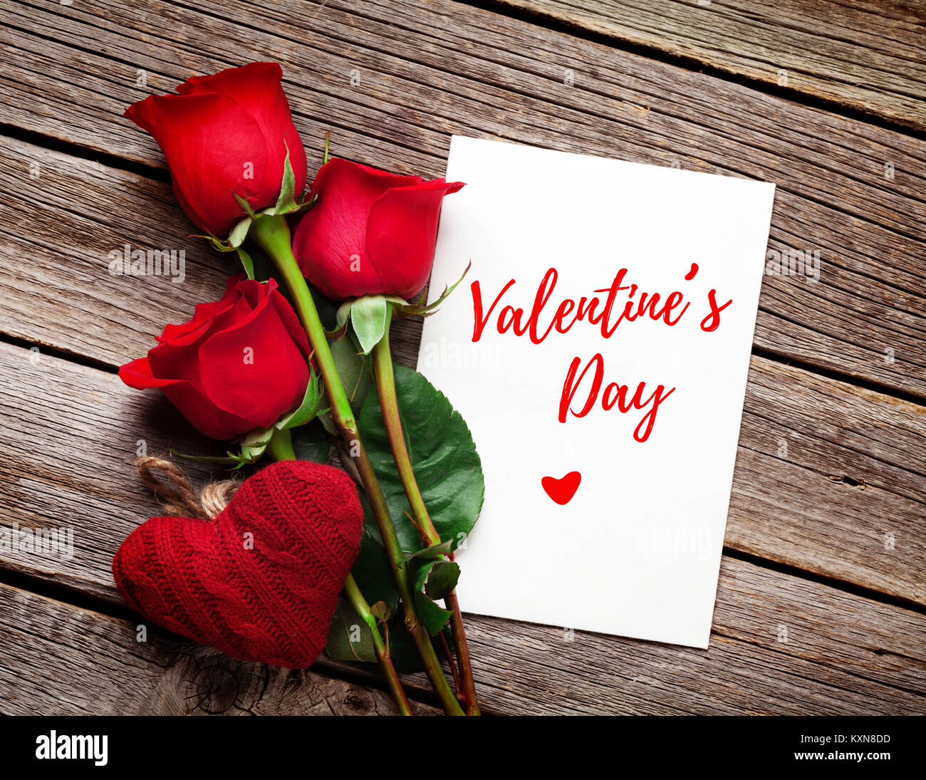 Valentines day greeting card, red rose flowers and heart on wooden ...