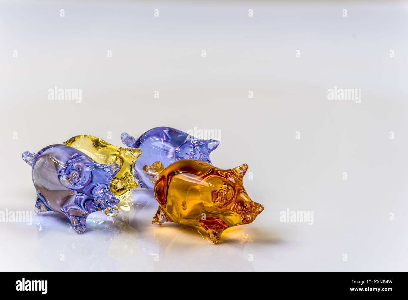 Cute glass pig figurines isolated on light background Stock Photo - Alamy