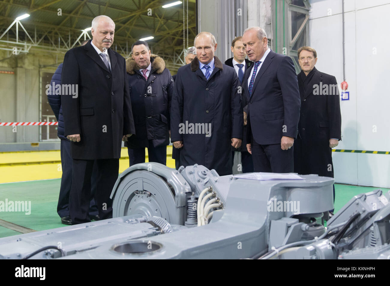 Tver, Russia. 10th Jan, 2018. Russian President Vladimir Putin (C) visits the Tver Carriage Works in Tver, Russia, on Jan. 10, 2018. Inflation in Russia hit a record low of 2.5 percent last year, the country's official statistics service Rosstat said Wednesday. The Russian economy is improving and the positive momentum continues, President Vladimir Putin said Wednesday when visiting the railway carriage factory. Credit: Bai Xueqi/Xinhua/Alamy Live News Stock Photo