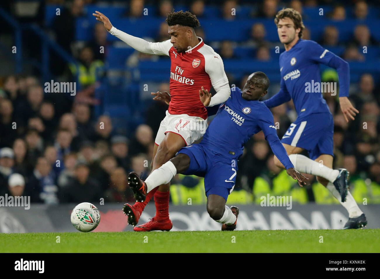 London, UK. 10th Jan, 2018. Arsenal's Alex Iwobi (L) vies with Chelsea's Ngolo Kante during the English League Cup semi-final 1st leg match between Chelsea and Arsenal at Stamford Bridge Stadium in London, Britain on Jan. 10, 2018. Chelsea and Arsenal drew 0-0. Credit: Tim Ireland/Xinhua/Alamy Live News Stock Photo