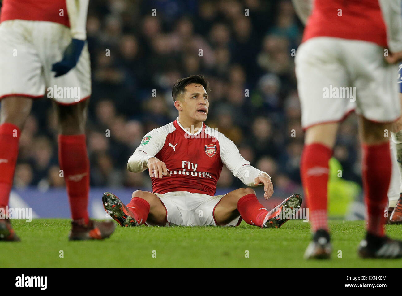 London, UK. 10th Jan, 2018. Arsenal's Alexis Sanchez sits on the pitch dejected during the English League Cup semi-final 1st leg match between Chelsea and Arsenal at Stamford Bridge Stadium in London, Britain on Jan. 10, 2018. Chelsea and Arsenal drew 0-0. Credit: Tim Ireland/Xinhua/Alamy Live News Stock Photo