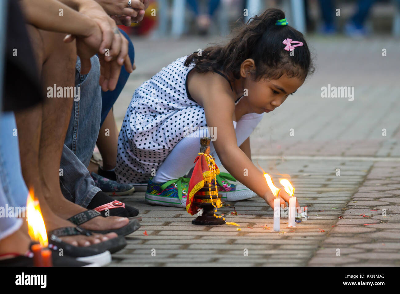 Cebu City, Philippines . 10th Jan, 2018. After an early morning candelelight procession attended by thousands of Catholics in Cebu City,Filipinos gather around the Basilica Minore del Santo Nino participating in prayer and singing of the hymn Bato Balani.Many will have brought with them Santo Nino figurines which represents their belief in the Child Jesus,Santo Nino de Cebu. Credit: imagegallery2/Alamy Live News Stock Photo