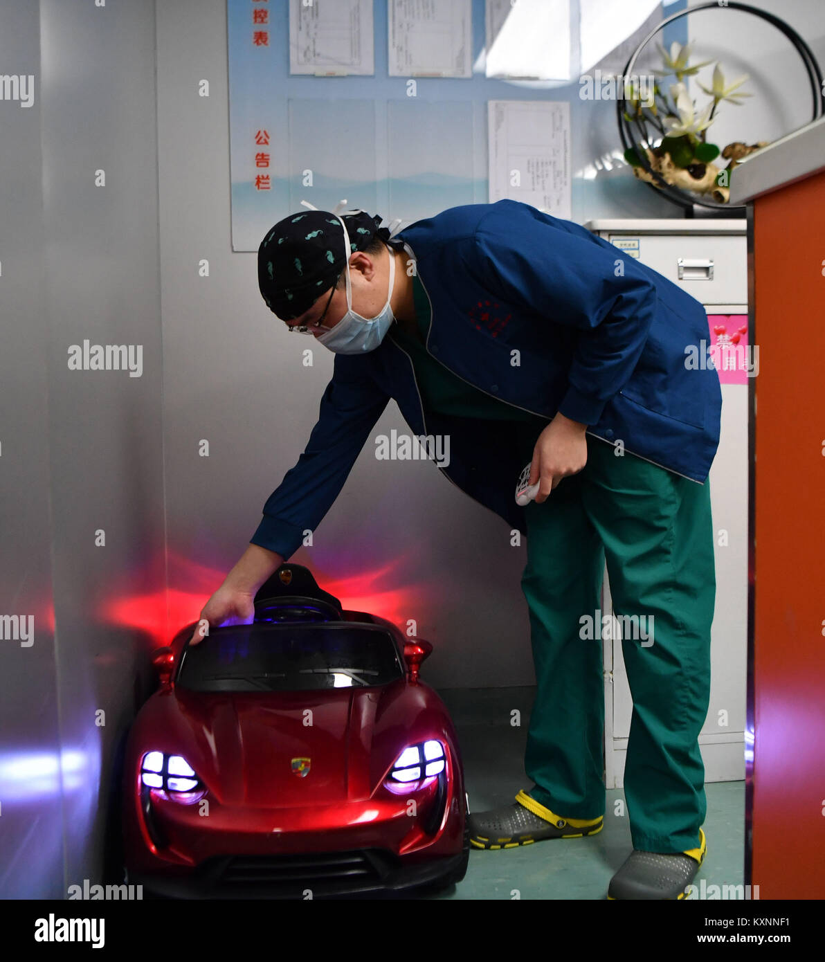 Changsha, China's Hunan Province. 11th Jan, 2018. Anesthetist Peng Tuochao cleans a toy car in Hunan Children's Hospital in Changsha, capital of central China's Hunan Province, Jan. 11, 2018. Since October in 2017, the hospital started to allow children 'drive' toy cars to operating room in order to ease their nervousness before surgery. Credit: Xue Yuge/Xinhua/Alamy Live News Stock Photo