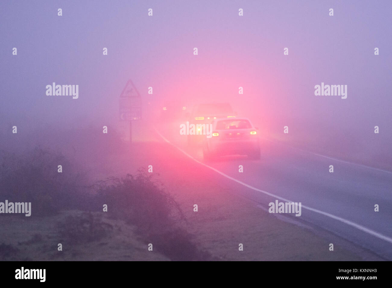 Driving in foggy weather with fog lights on, UK Stock Photo Alamy