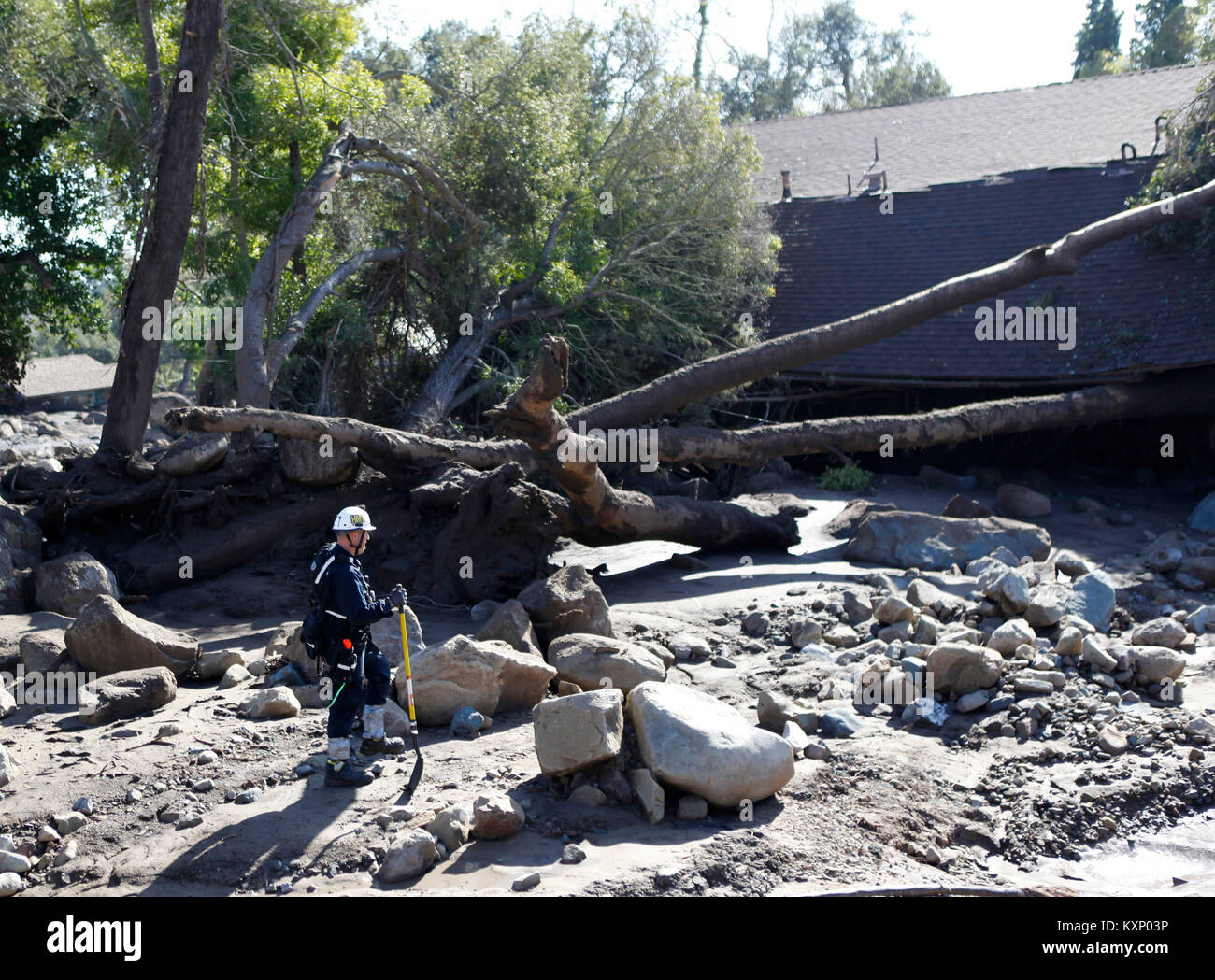 Montecito, California, USA. 11th Jan, 2018. A Search and Rescue from Fresno California searches a street of houses that where destroyed in the massive mudslide in Montecito, CA Wednesday January 11, 2018. Credit: Daniel Dreifuss/Alamy Live News Stock Photo