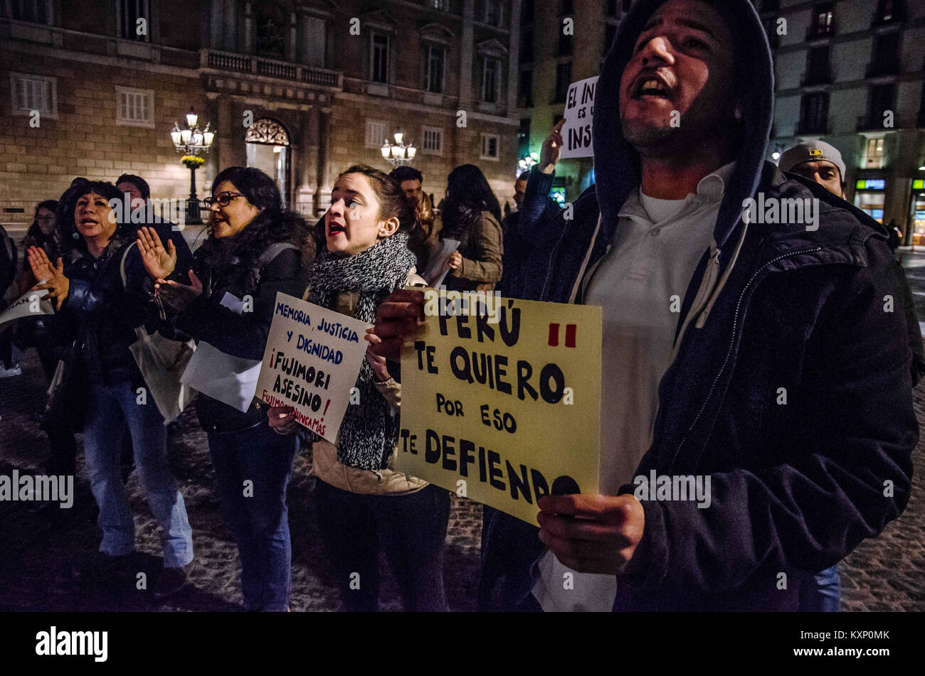 Barcelona, Catalonia, Spain. 11th Jan, 2018. Several demonstrators displayed posters against Fujimori and his crimes. A group of resident Peruvians in Barcelona have gathered to protest on Barcelona's Sant Jaume square to show their rejection of the early release of Alberto Fujimori. This is the second protest against the pardon granted by the current President of the PerÃº Pedro Pablo Kucznski to the former President Alberto Fujimori. Credit: Paco Freire/SOPA/ZUMA Wire/Alamy Live News Stock Photo