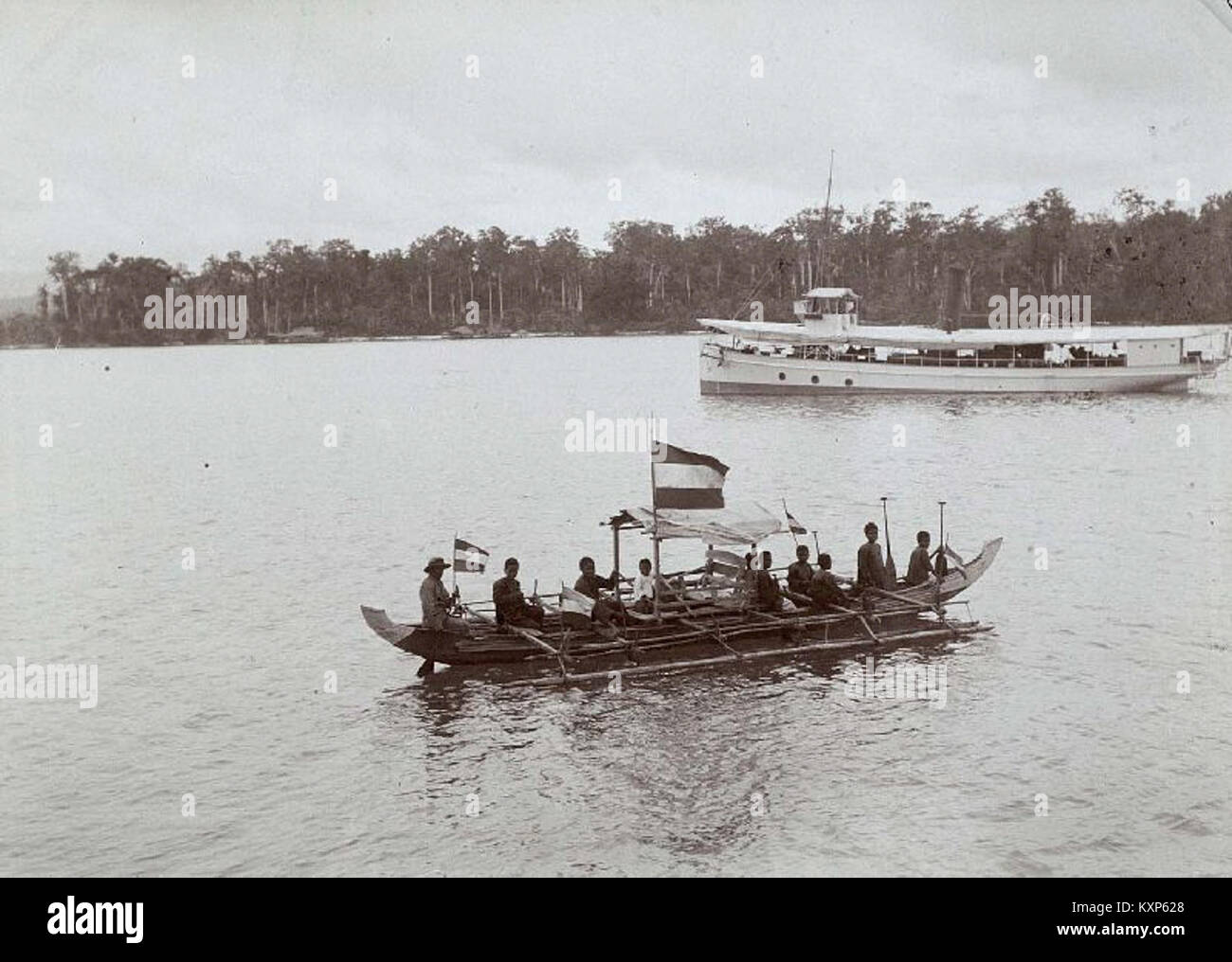 A historical image depicting children paddling a proa, a type of boat, in a scene associated with Protestant missionary Van Hasselt, highlighting cultural interactions and history. Stock Photo