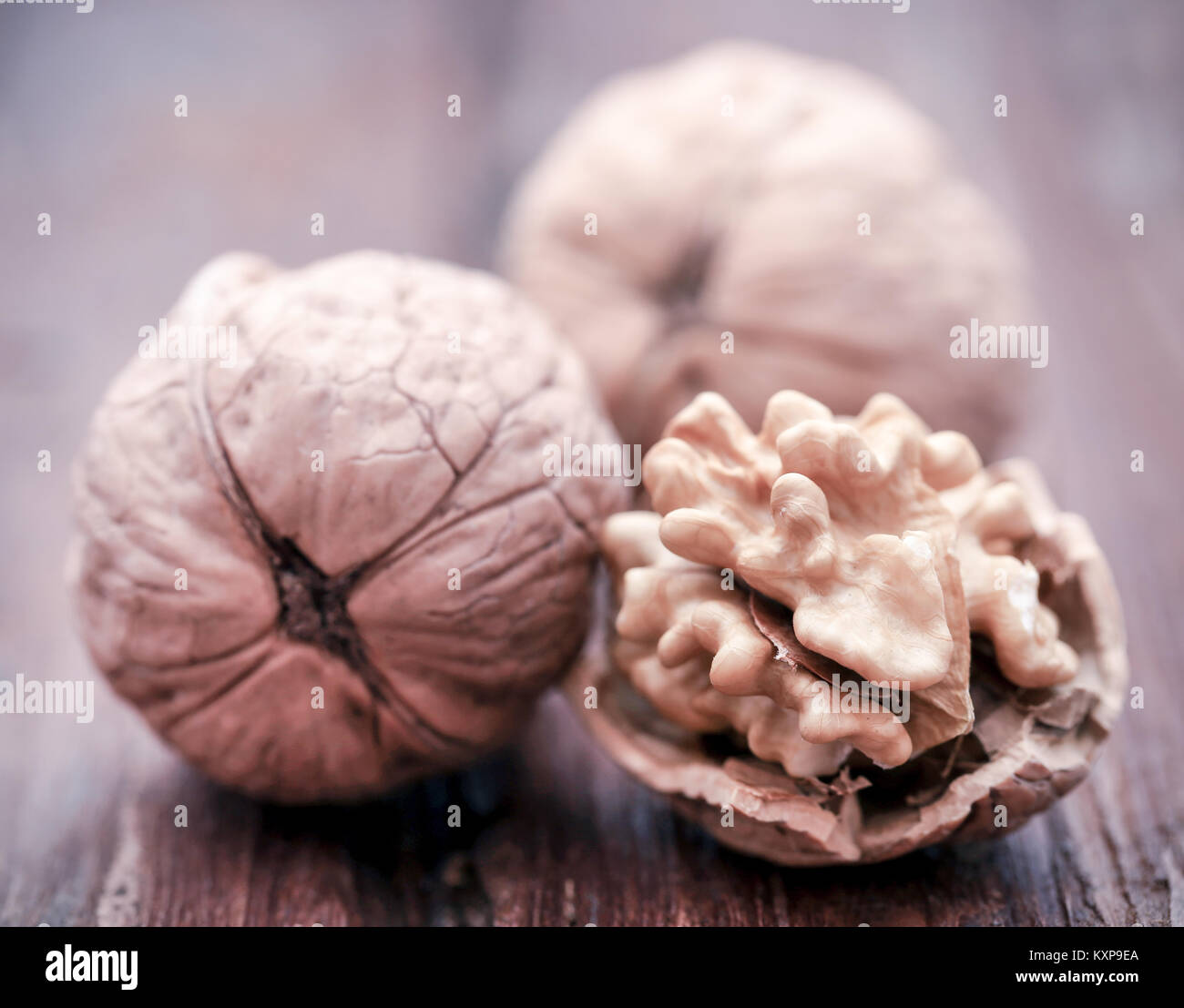 Some walnut closeup in natural surface Stock Photo - Alamy