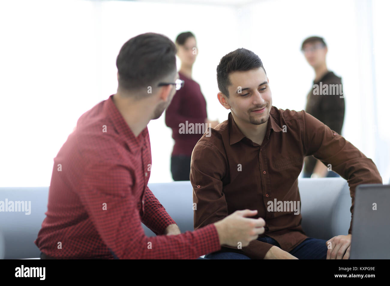Two men working on laptop in the office Stock Photo - Alamy