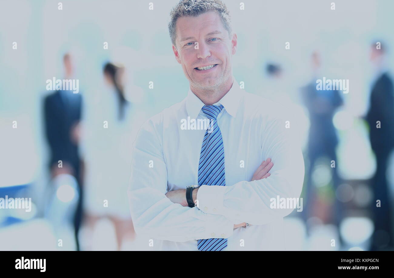 Portrait of happy smiling businessman in a modern office Stock Photo ...