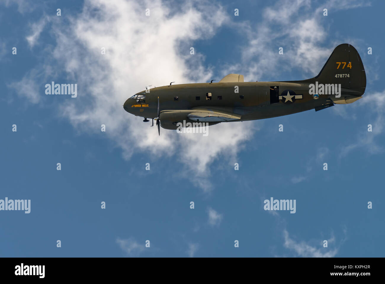 READING, PA - JUNE 3, 2017: CURTISS C-46 'COMMANDO''TINKER BELLE'in flight during World War II reenactment at Mid-Atlantic Air Museum Stock Photo