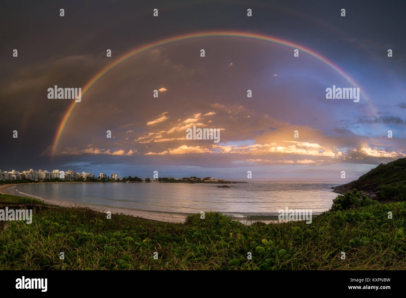 Beautiful Rainbow over Peracanga Beach, Guarapari, Espirito Santo State, Brazil. Stock Photo