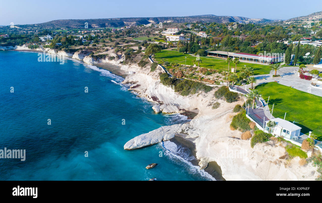 Aerial view of coastline and landmark big white chalk rock at Governor's beach, Limassol, Cyprus. The steep stone cliffs and deep blue sea waves crush Stock Photo