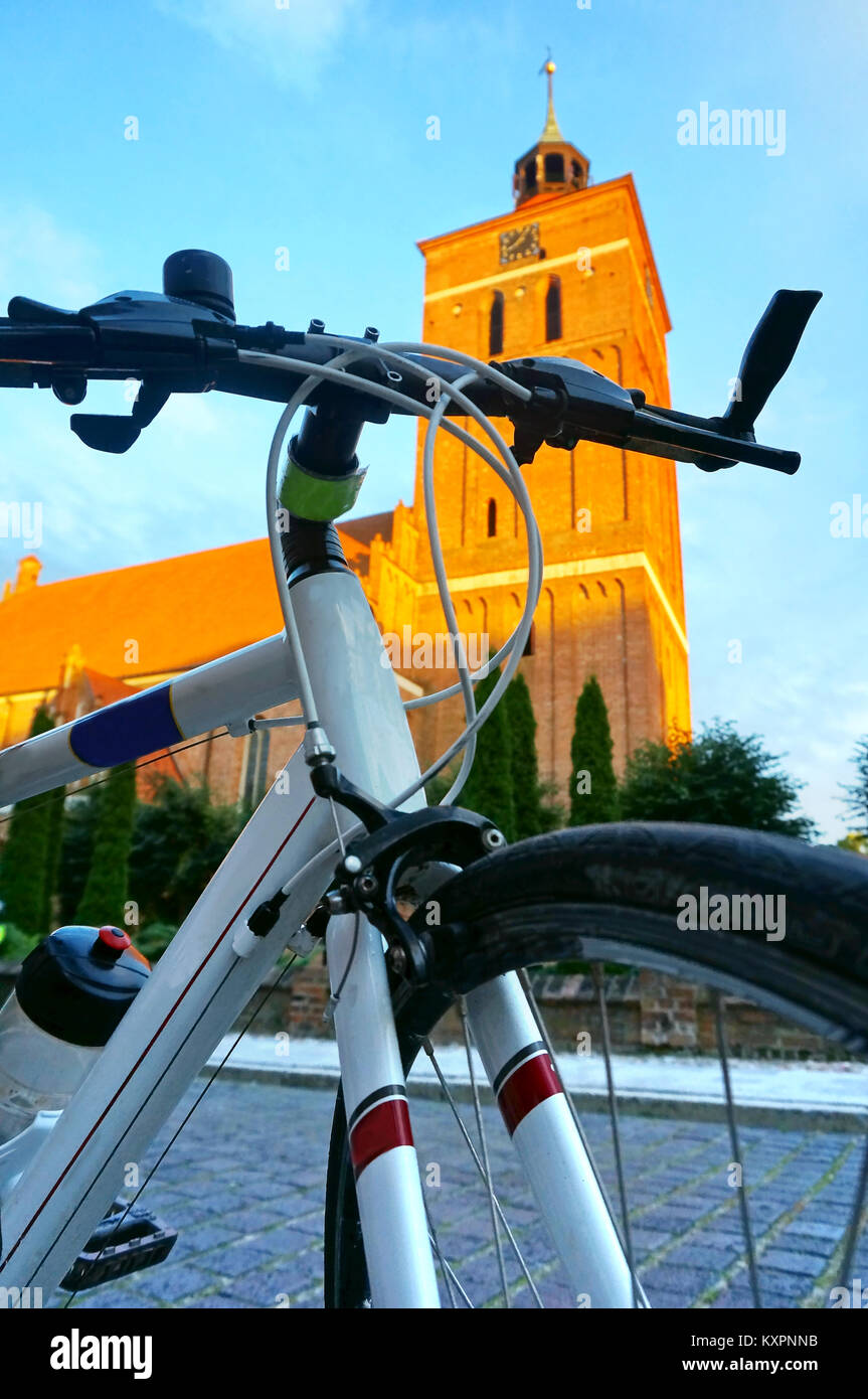 the front part of a white Bicycle, the bike on the background architecture Stock Photo