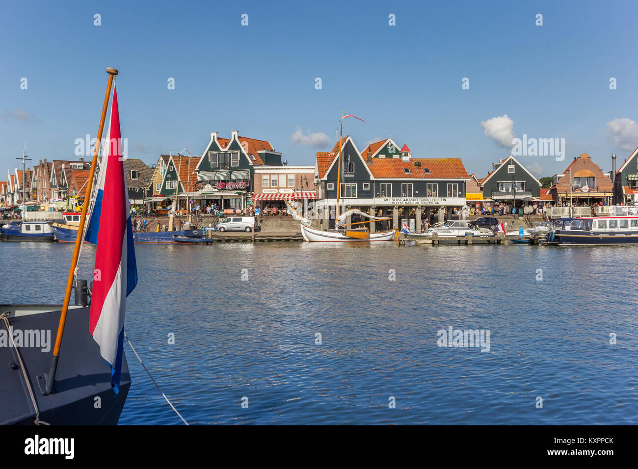 Dutch flag in front of the harbor of Volendam, Holland Stock Photo