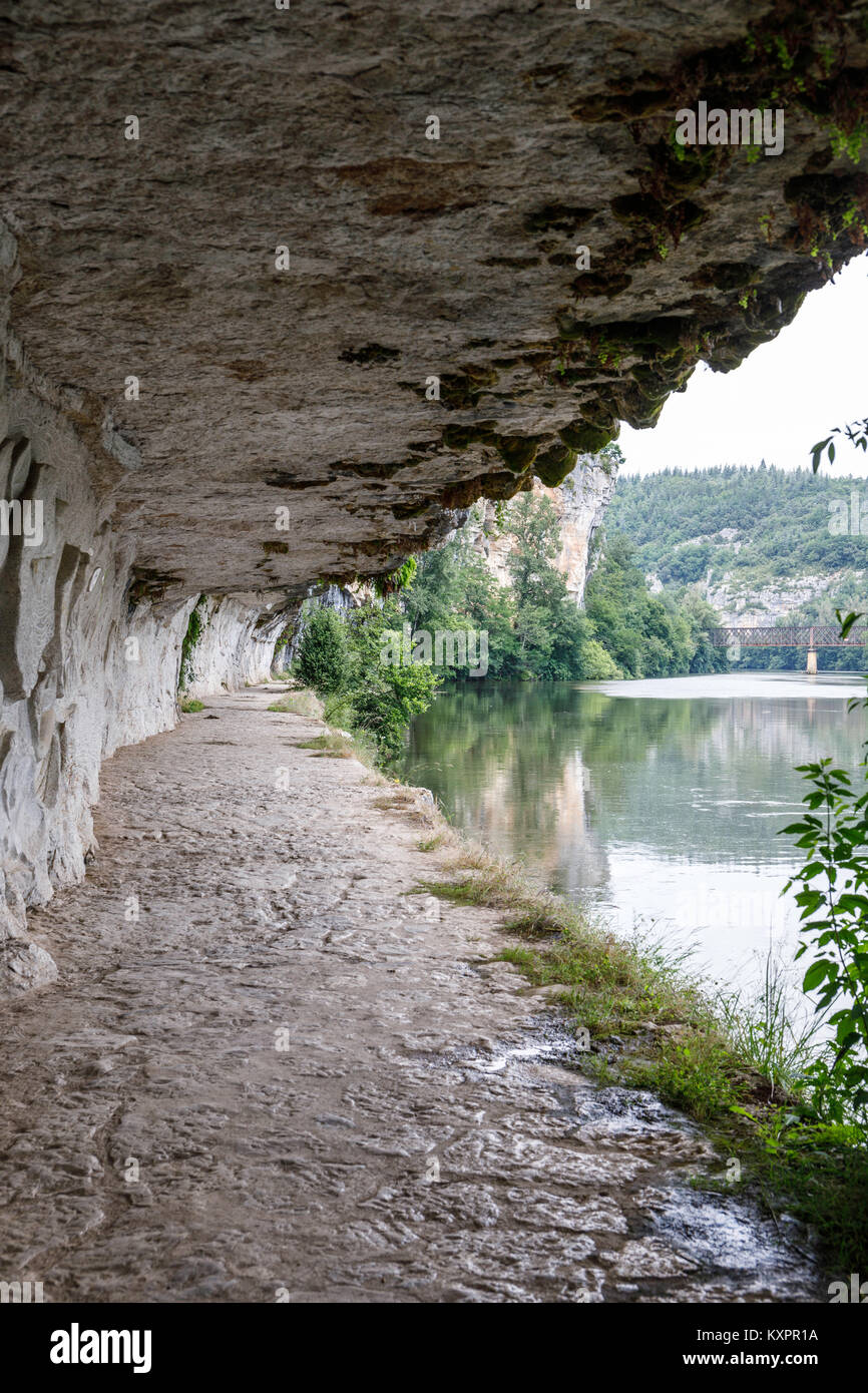 The Lot River Navigation tow path cut into the cliff rock side Stock Photo