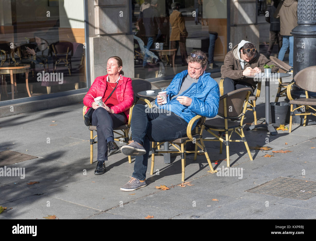 Tourists sunbathing on a terrace. Stock Photo