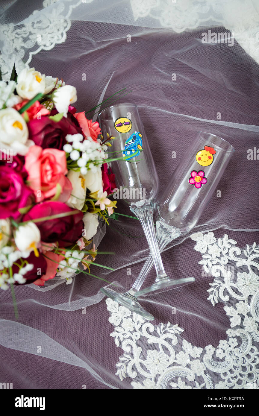 Bridal bouquet and glasses for newly weds. Fun wedding details Stock Photo