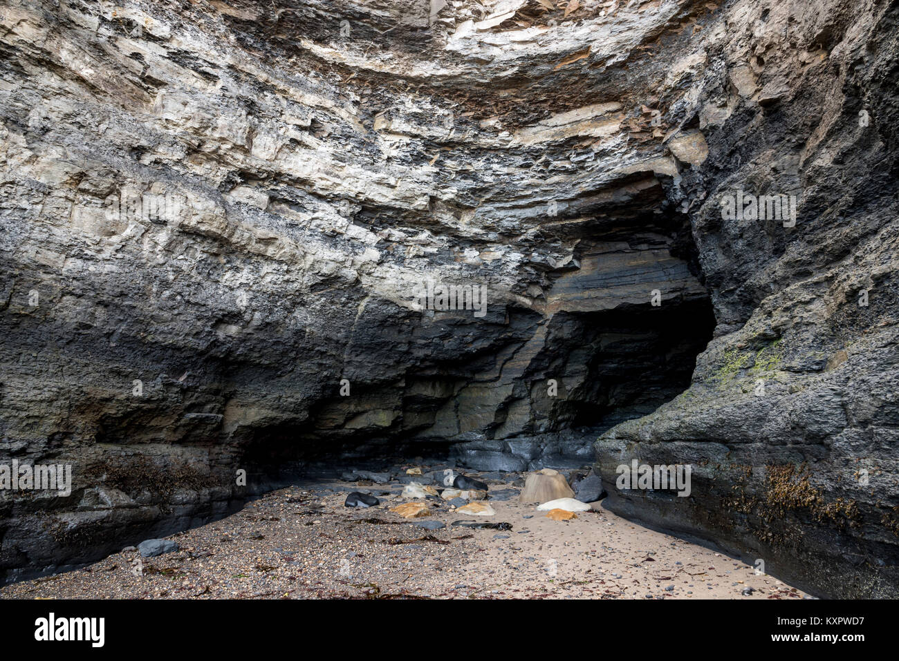 Coastal cave at Boggle Hole near Robin Hood's Bay, North Yorkshire, England. Stock Photo