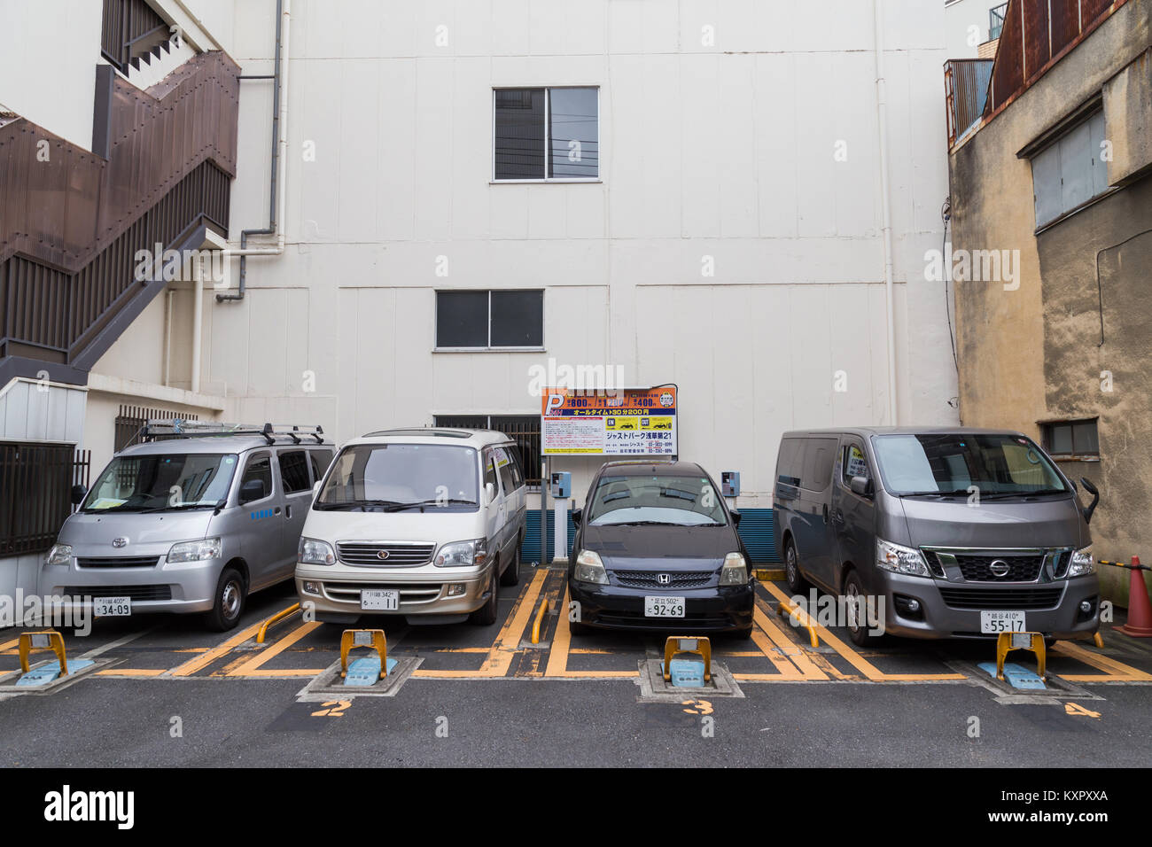 Tokyo, Japan - Obtober 26, 2016 : car parking business in Tokyo, Japan. small spacing between the building can make car park service business in Japan Stock Photo