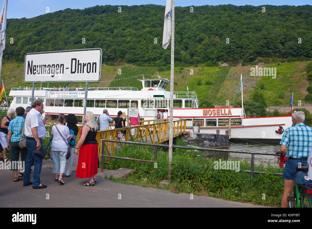 Tourists at landing stage for Moselle roundtrips, Neumagen-Dhron, Moselle river, Rhineland-Palatinate, Germany, Europe Stock Photo