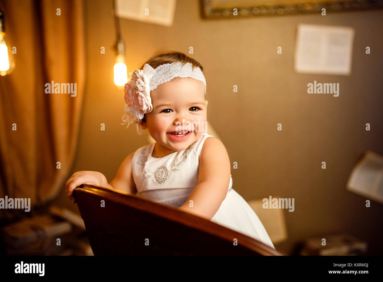Portrait of a beautiful little baby in pink dress and . Close-up Stock ...