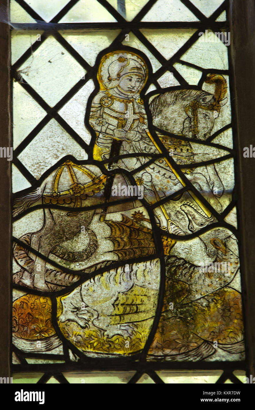 UK, England, Oxfordshire, Kelmscott, St George’s Church, chancel, 1430 stained glass window showing Saint George slaying the dragon Stock Photo