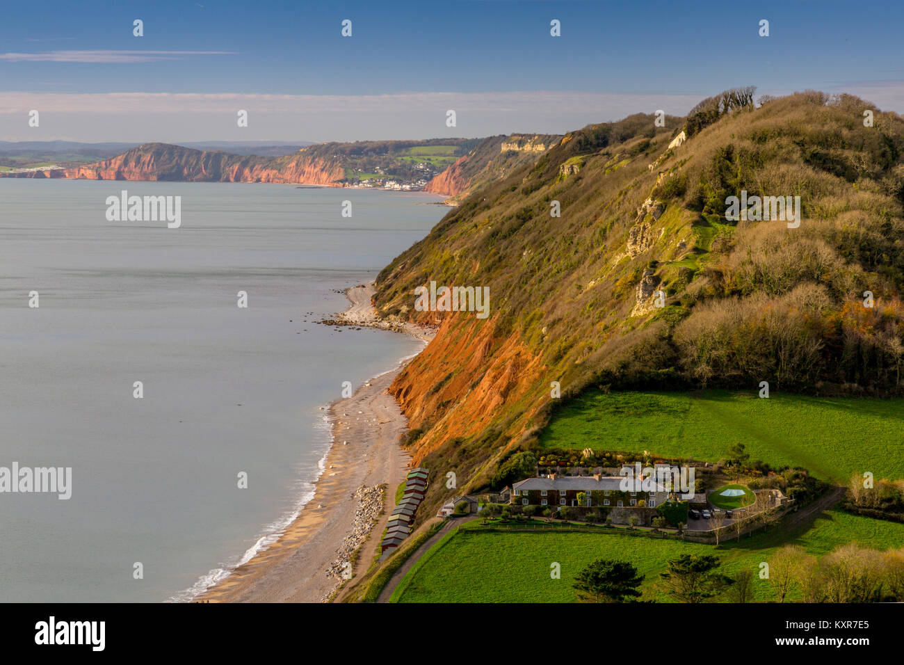 Looking west from Branscombe beach towards the red sandstone cliffs at Sidmouth on the Jurassic Coast, Devon, England, UK Stock Photo