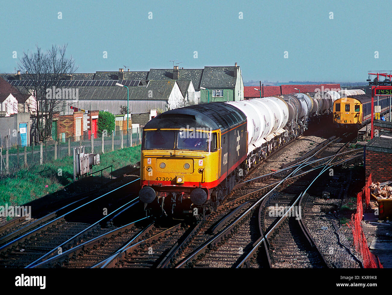 A class 47 diesel locomotive number 47302 working a wagonload freight approaching Gillingham in Kent. 19th March 1993. Stock Photo