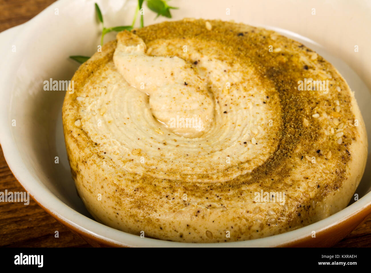 Vegetarian Humus with sesame seeds and thyme leaves Stock Photo Alamy