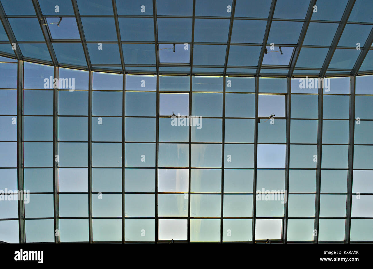 Huge glass roof inside building from bellow Stock Photo