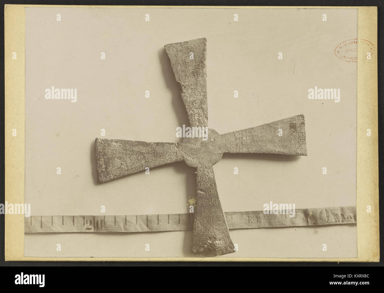This image depicts a cross with an inscription from Archiac, dated 1658 ...