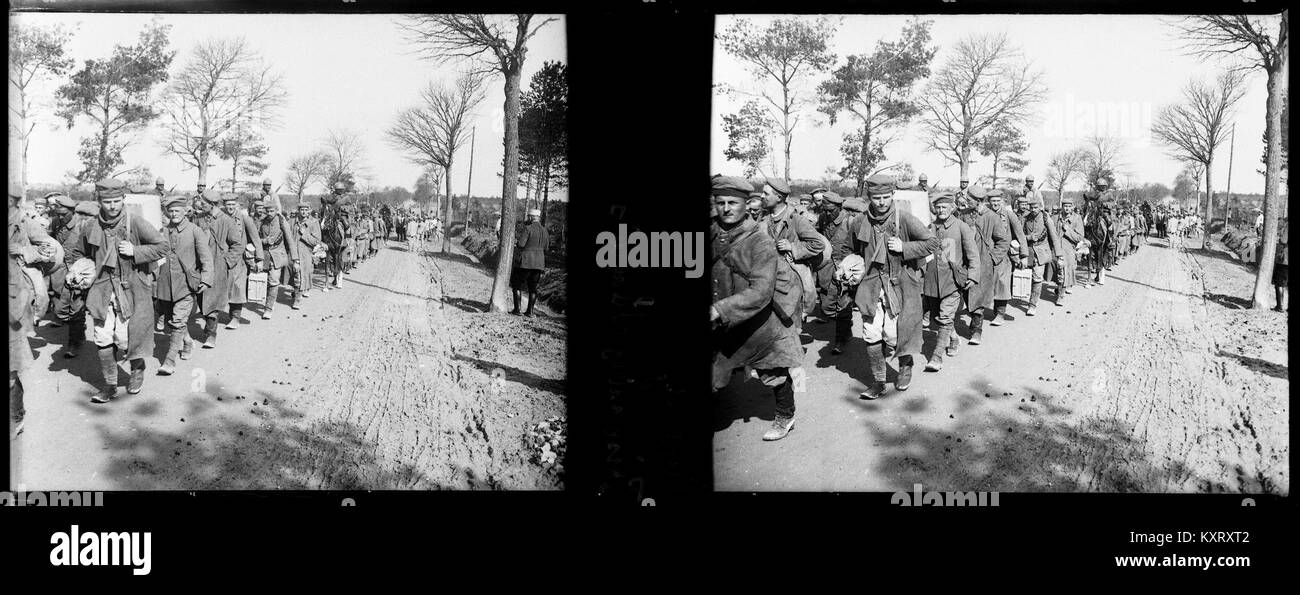 The image depicts German prisoners of war during World War I in Cuperly, France. Captured during military conflicts, the prisoners are shown in a historical context, reflecting the wartime struggles. Stock Photo