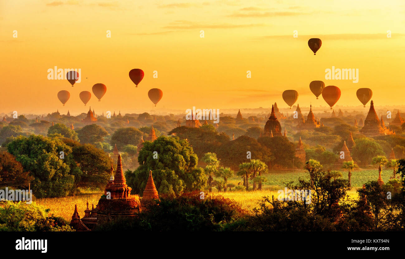 Hot air balloons flying over beautiful pagodas at sunrise in Bagan, Myanmar  Stock Photo - Alamy