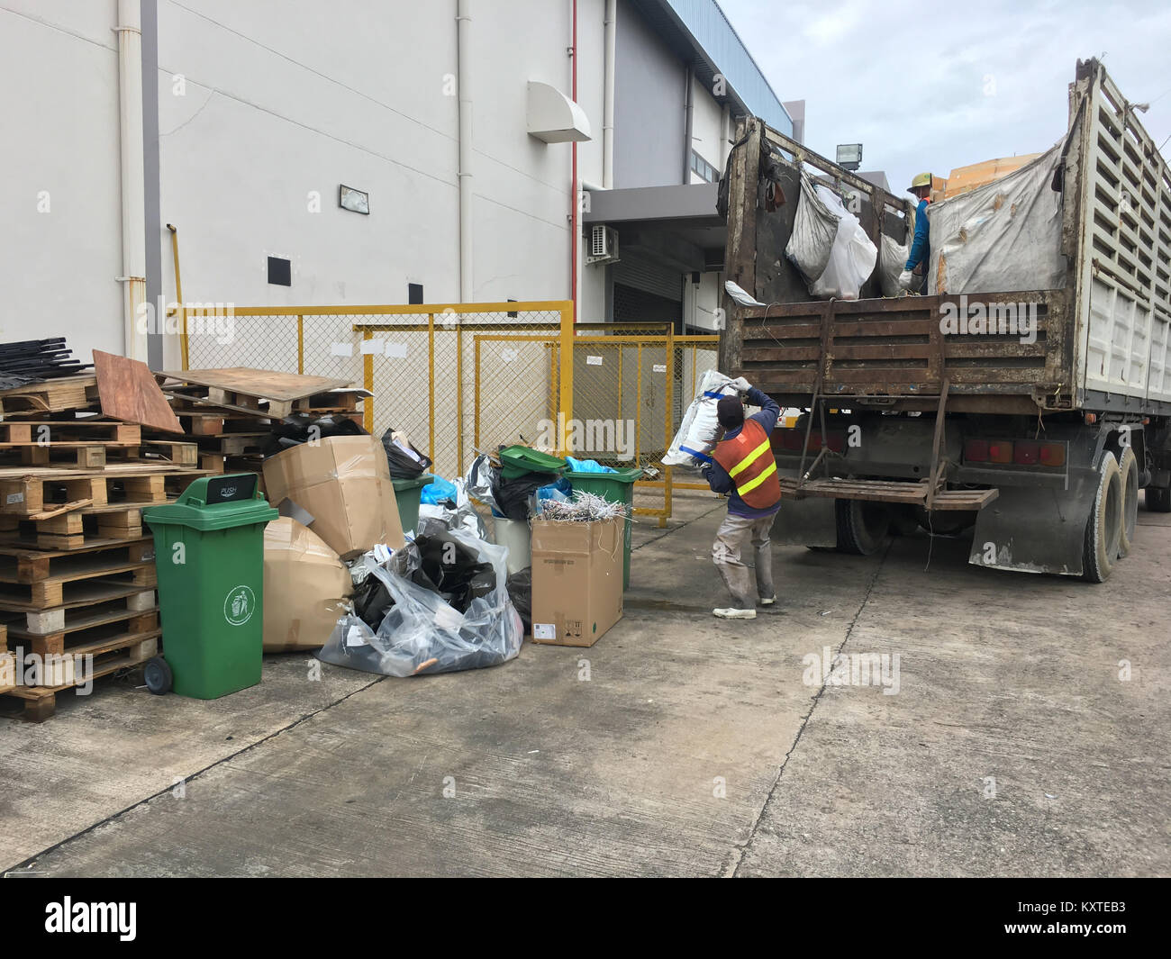 Workers are collecting garbage into garbage trucks Stock Photo Alamy