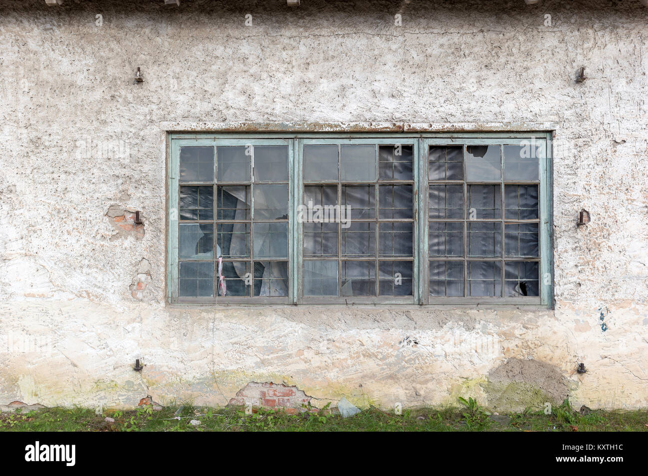 Old window in historic building. Grunge background texture for design Stock Photo