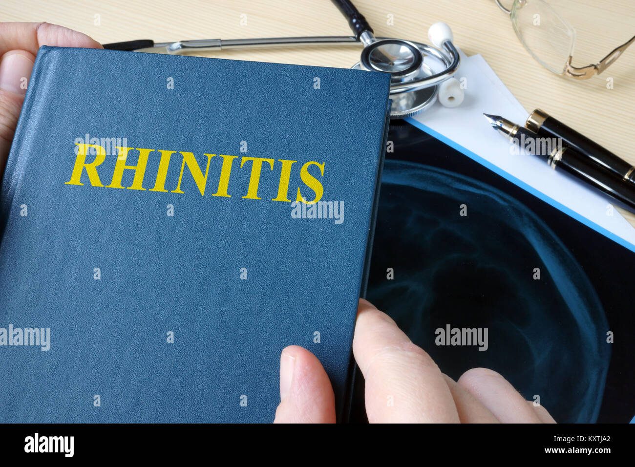 Book about Rhinitis on a hospital desk. Stock Photo