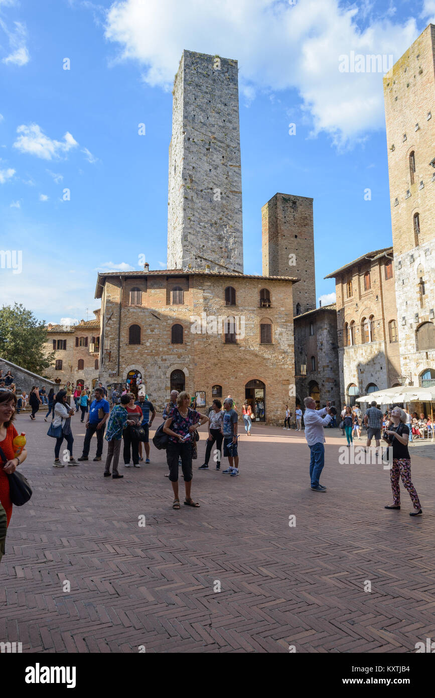 San Gimignano, Italy  - September 24, 2016:  Tourists are visiting the famous town San Gimignano in tuscany, Italy Stock Photo